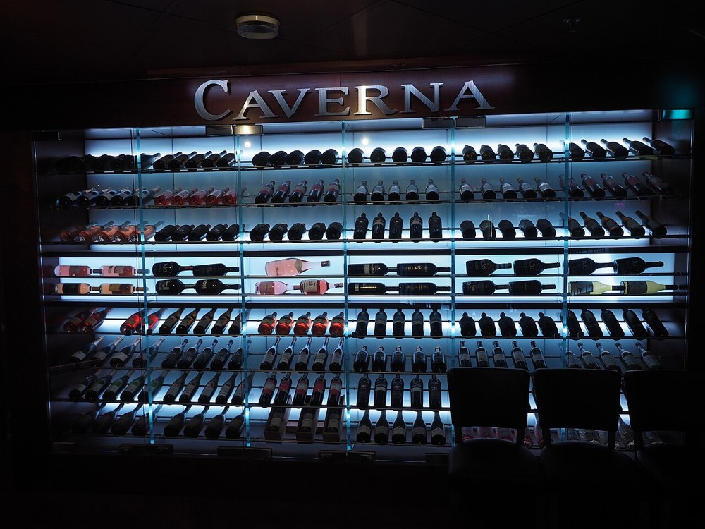 Wine bottles stored on racks at Caverna restaurant